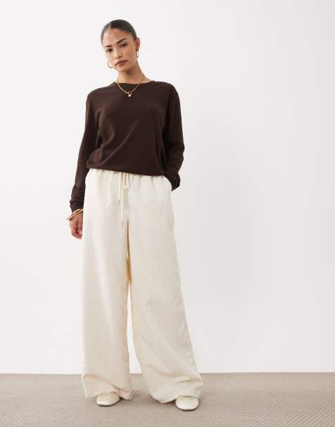 ASOS DESIGN Petite - pantalones de pana de pernera ancha con cintura elástica en color eggnog - view 1