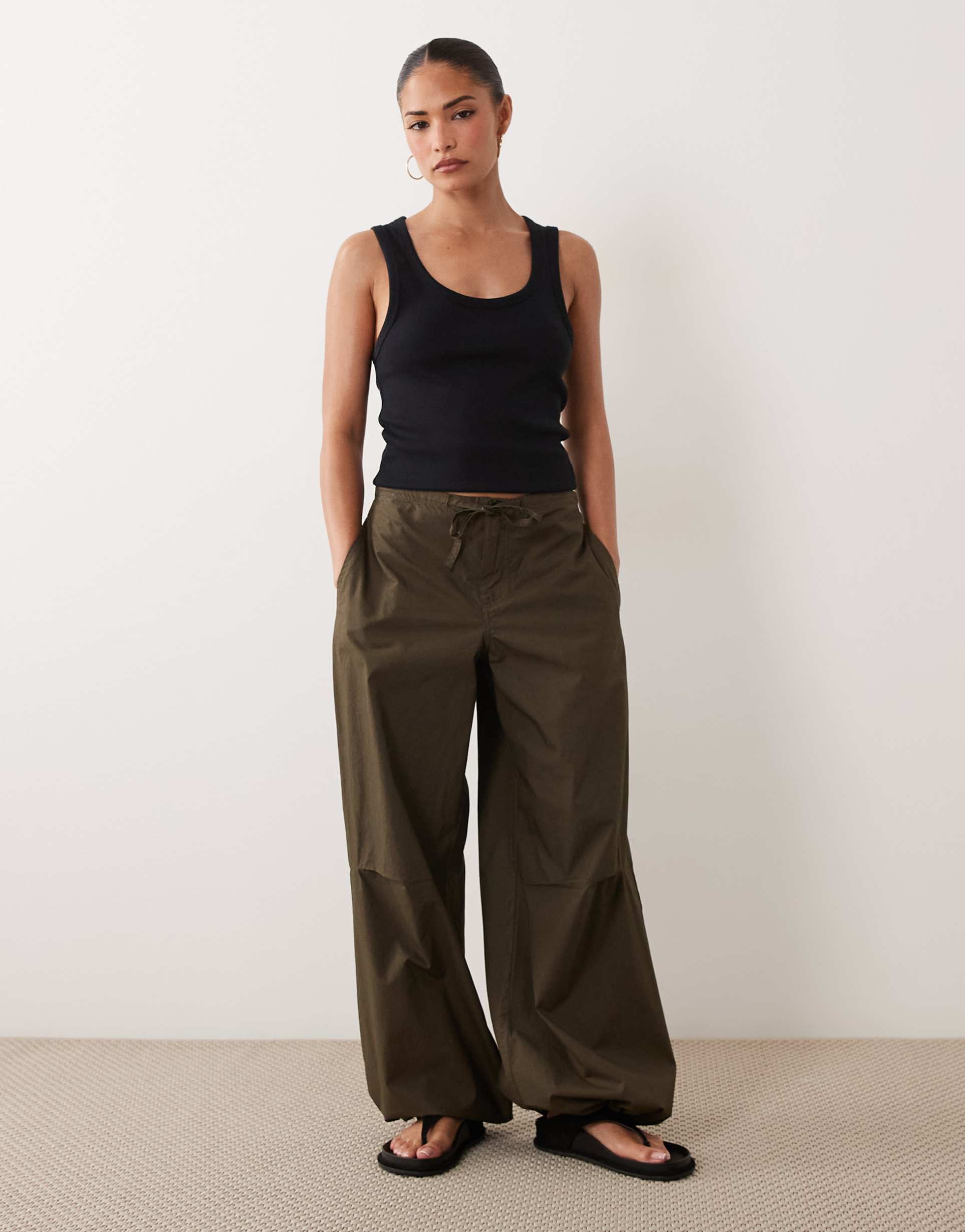 asos design petite parachute pants with toggle hem detail in khaki