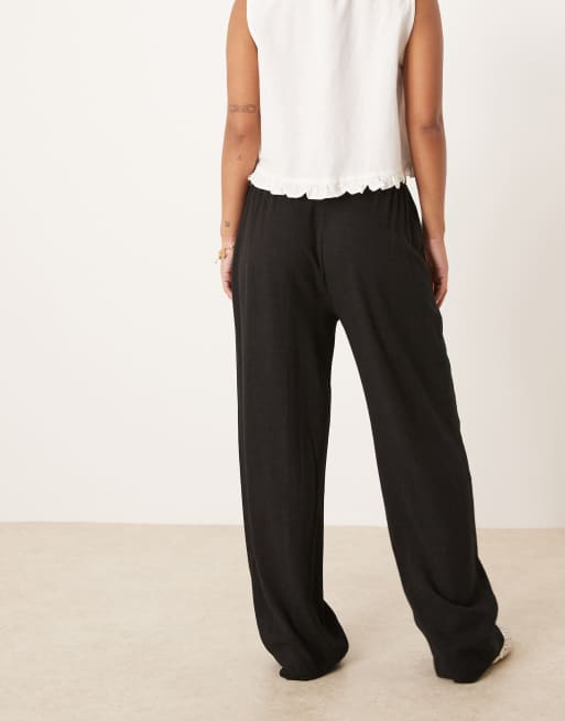 ASOS DESIGN Petite pleat front tapered trousers with linen in black, 3 of 5