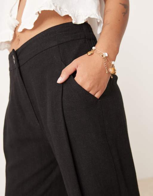 ASOS DESIGN Petite pleat front tapered trousers with linen in black, 5 of 5