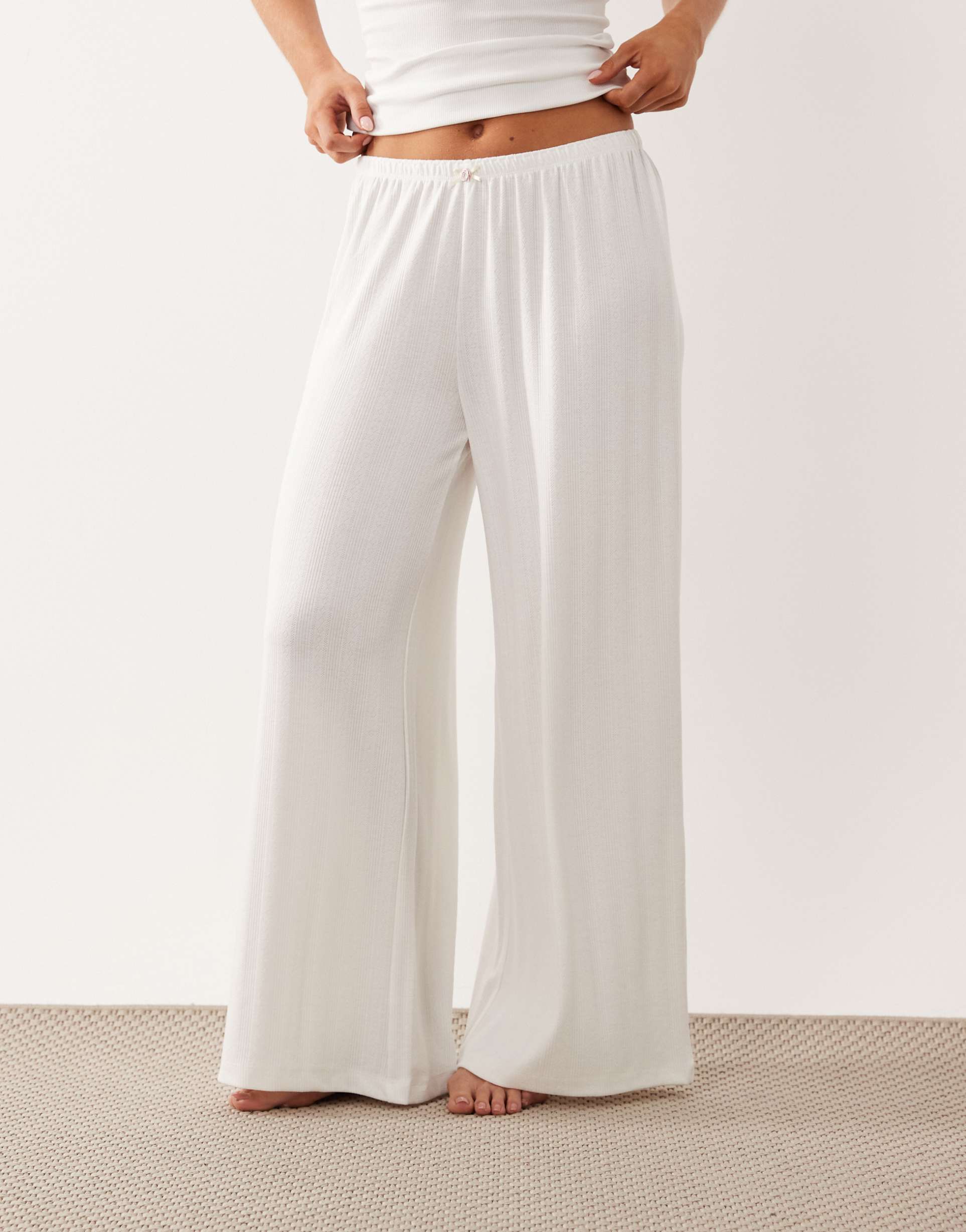 asos design petite pointelle wide leg pajama pants with rosebud trim in white