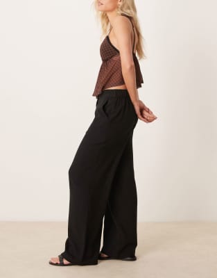 ASOS DESIGN Petite relaxed straight leg linen mix pants in black