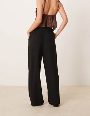 ASOS DESIGN Petite relaxed straight leg linen mix pants in black