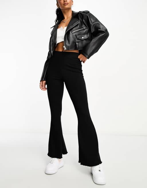 ASOS DESIGN Petite rib flare pants with lettuce hem in black | ASOS