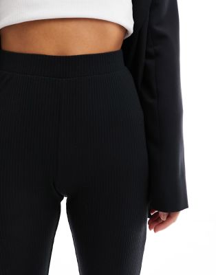 ASOS PETITE ASOS DESIGN PETITE RIBBED FLARE PANTS WITH LETTUCE HEM 
