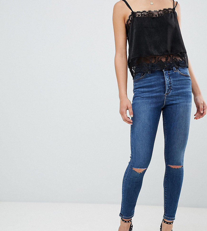ASOS DESIGN Petite Ridley high waist skinny jeans in extreme dark stonewash with button fly and ripped knee-Blue