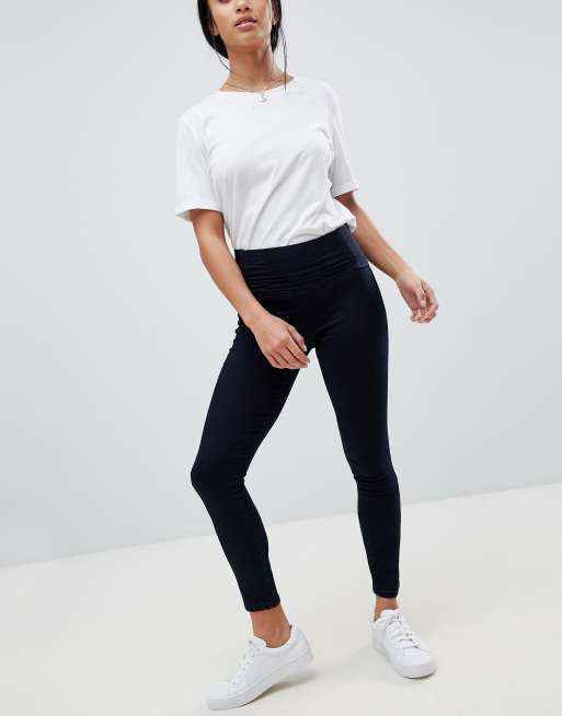 ASOS DESIGN Petite Rivington high waisted jeggings with Athleisure styling  in indigo wash