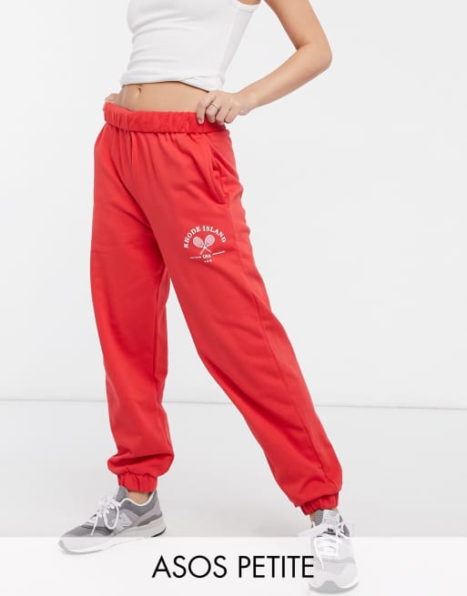 ASOS DESIGN Petite roll-waist oversized sweatpants with tennis logo in red