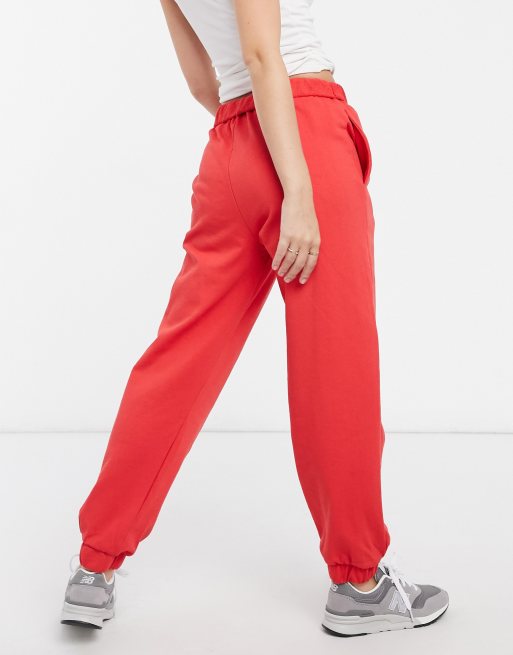 ASOS DESIGN roll waist oversized sweatpants with tennis logo in red