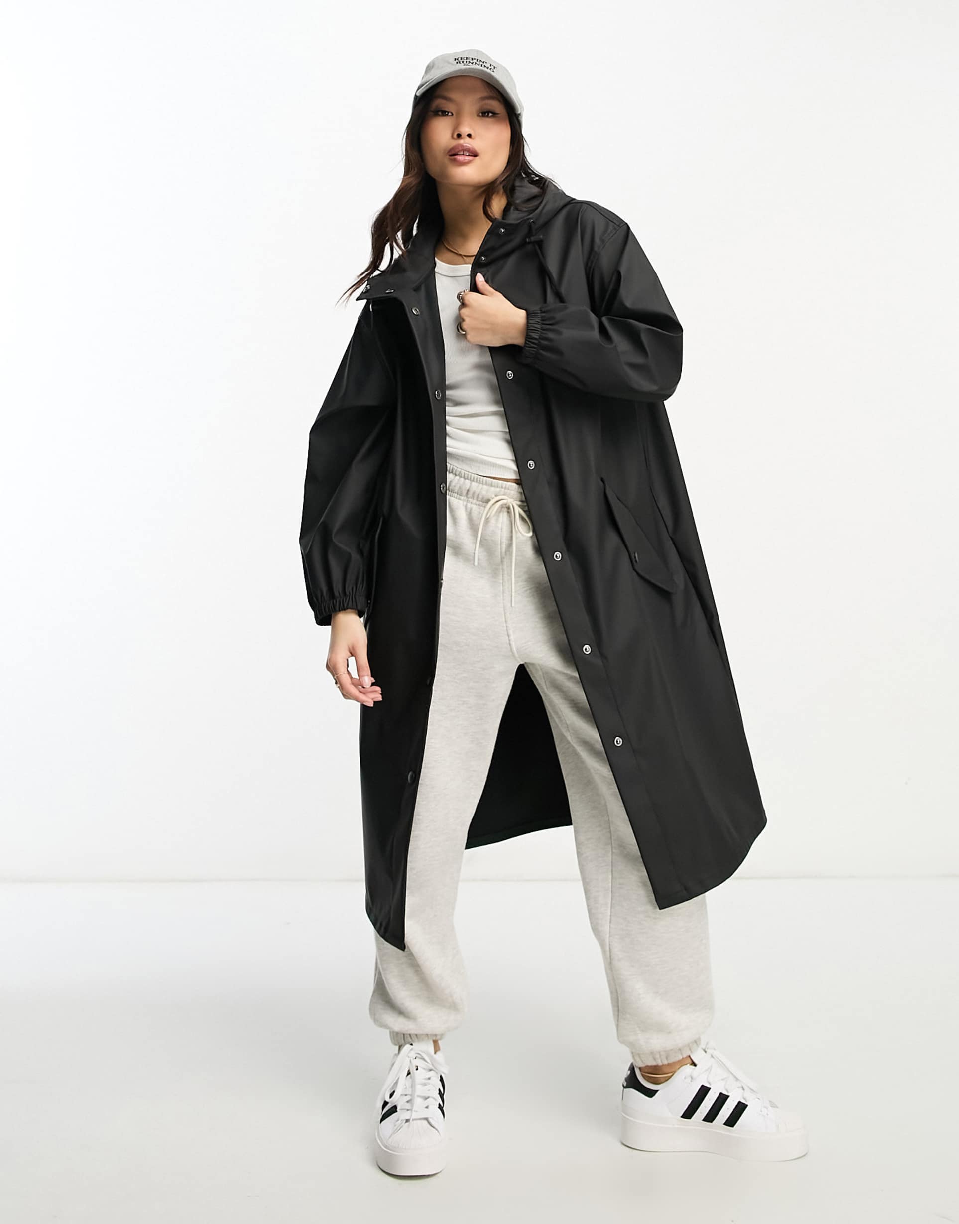 asos design petite rubberized rain parka coat in black