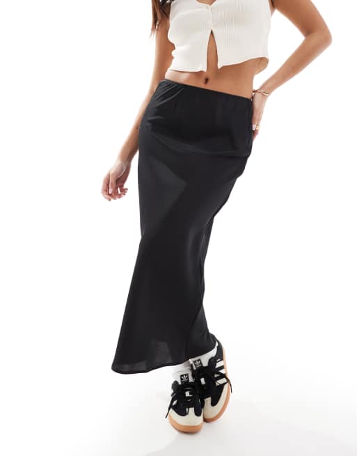 ASOS DESIGN Petite satin bias midi skirt in black ASOS