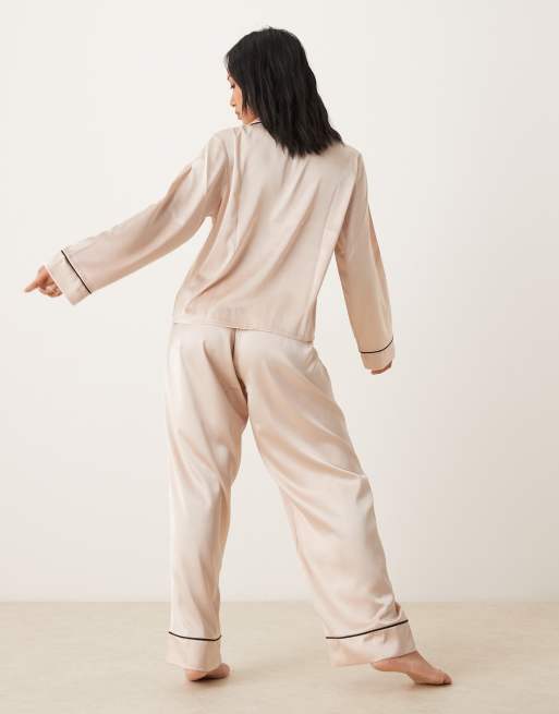 ASOS DESIGN Petite satin shirt & trouser pyjama set in champagne pink