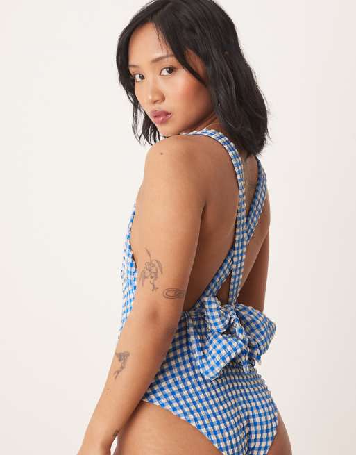 ASOS DESIGN Petite seersucker scoop swimsuit with giant bow back detail in blue gingham