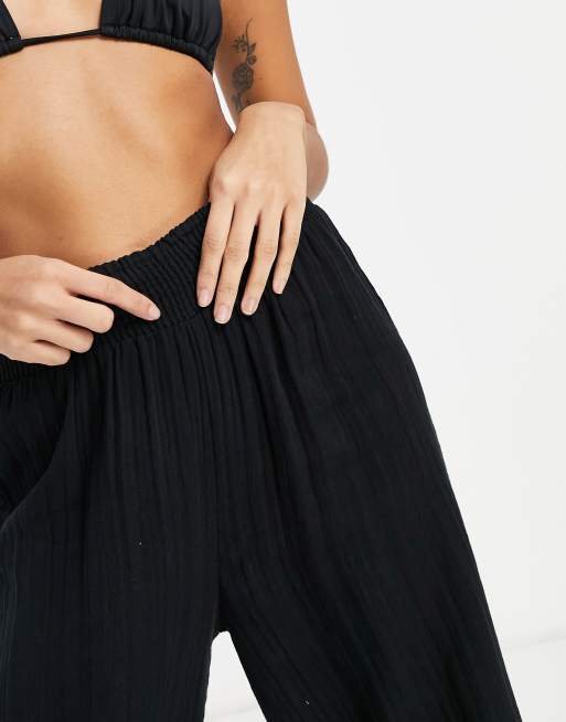 ASOS DESIGN Petite shirred harem beach pants in black