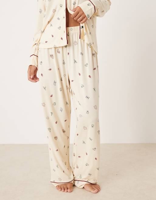 ASOS DESIGN Petite super soft long sleeve shirt & pants pajama set with contrast piping in Christmas icon print