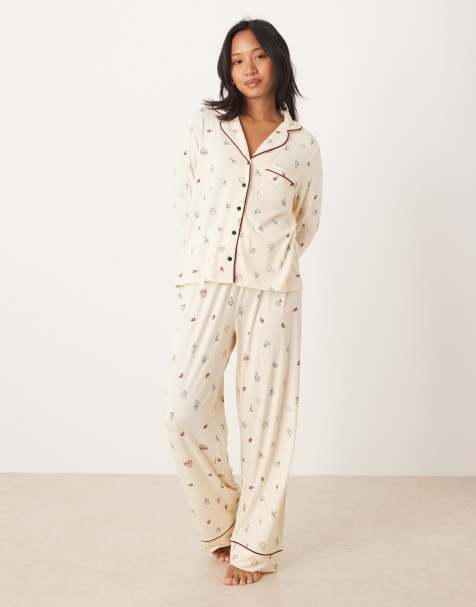 ASOS DESIGN Petite super soft long sleeve shirt & trouser pyjama set with contrast piping in Christmas icon print - view 1