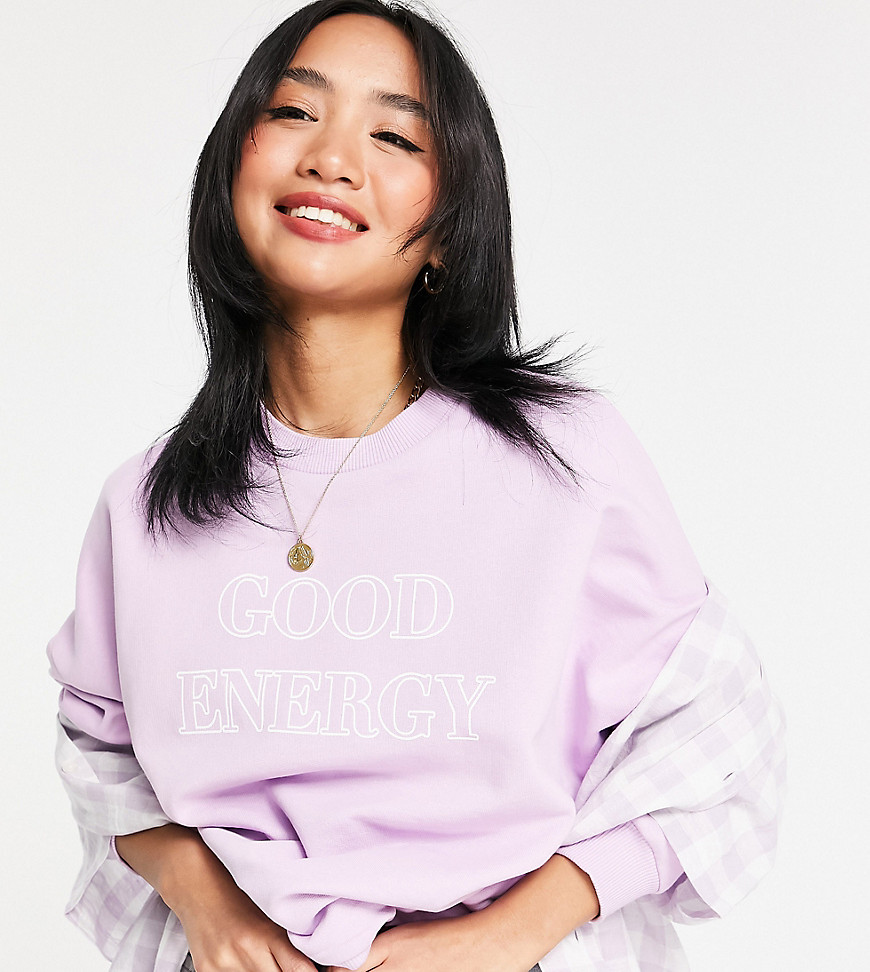 ASOS DESIGN Petite sweatshirt with 'Good Energy' print in pink-Purple