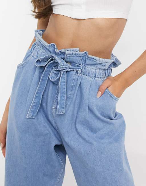 ASOS DESIGN Petite tapered leg jeans with paper bag waist in light vintage wash