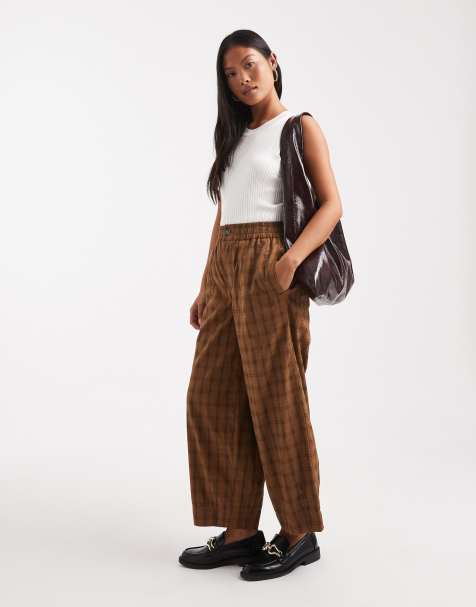 ASOS DESIGN Petite textured  barrel leg pull on trousers with seam detail in mustard check