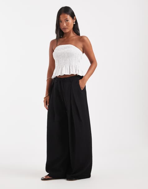 ASOS DESIGN Petite textured wide leg trousers with tie waist in black - view 1