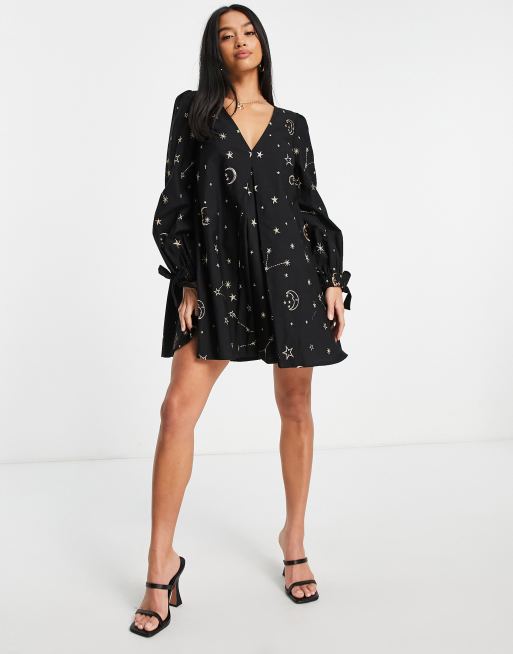 ASOS DESIGN Petite v front v back trapeze mini dress in star and moon  embroidery in black