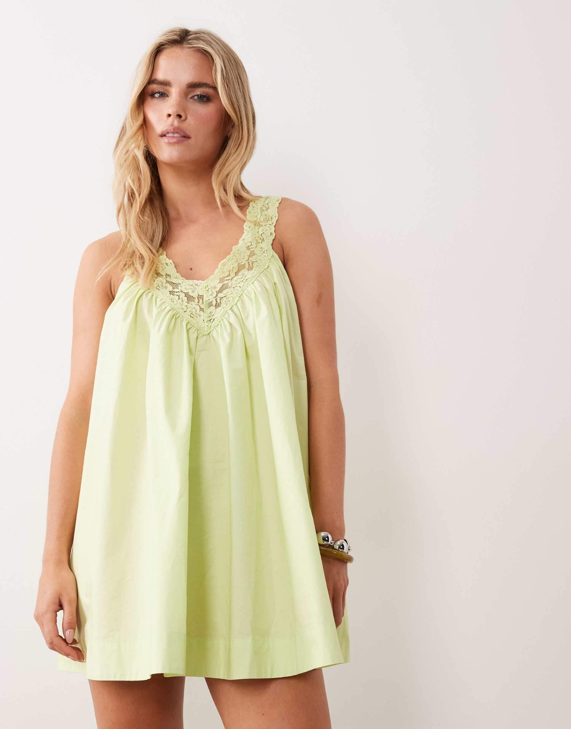 asos design petite v neck smock poplin mini dress with lace overlay in warm washed lime