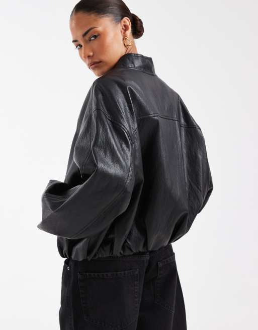 ASOS DESIGN Petite washed leather look oversized bomber jacket in washed black, 2 of 4