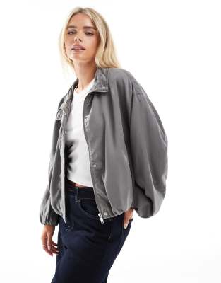 ASOS DESIGN Petite washed tencel ruched funnel neck jacket in charcoal