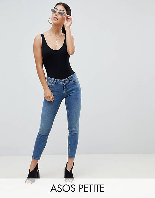 ASOS DESIGN Petite Whitby low rise skinny jeans in mid blue wash | ASOS