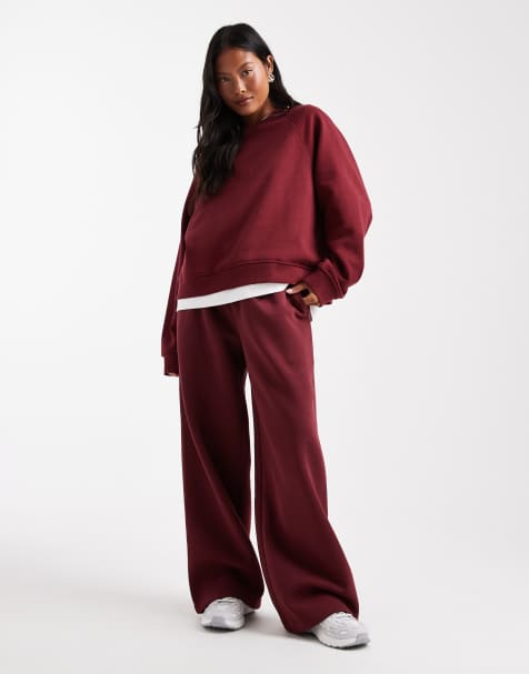ASOS DESIGN Petite wide leg brushback sweatpants in burgundy - view 1