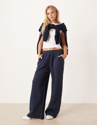 ASOS DESIGN Petite wide leg brushback trackies in navy | ASOS