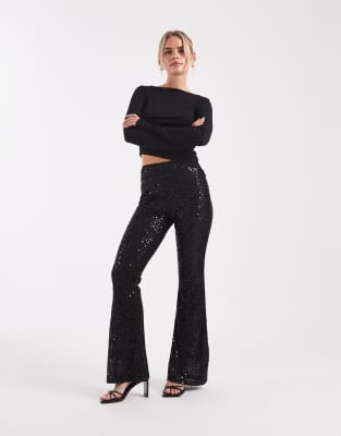 ASOS DESIGN Petite - Wiggle - Schlaghose aus transparentem Netzstoff in Schwarz mit Paillettenbesatz