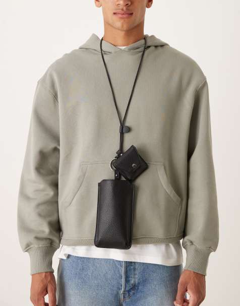 ASOS DESIGN phone pouch with strap in black - view 1