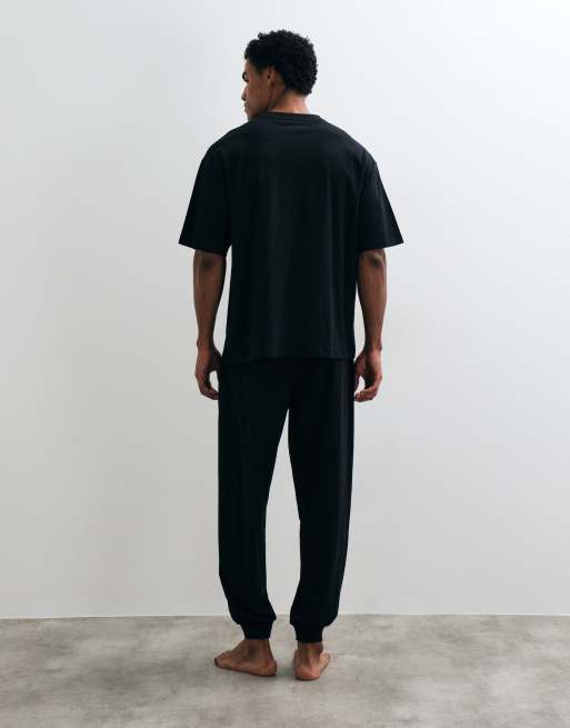 ASOS DESIGN pink panther pyjama set in black, 3 of 4
