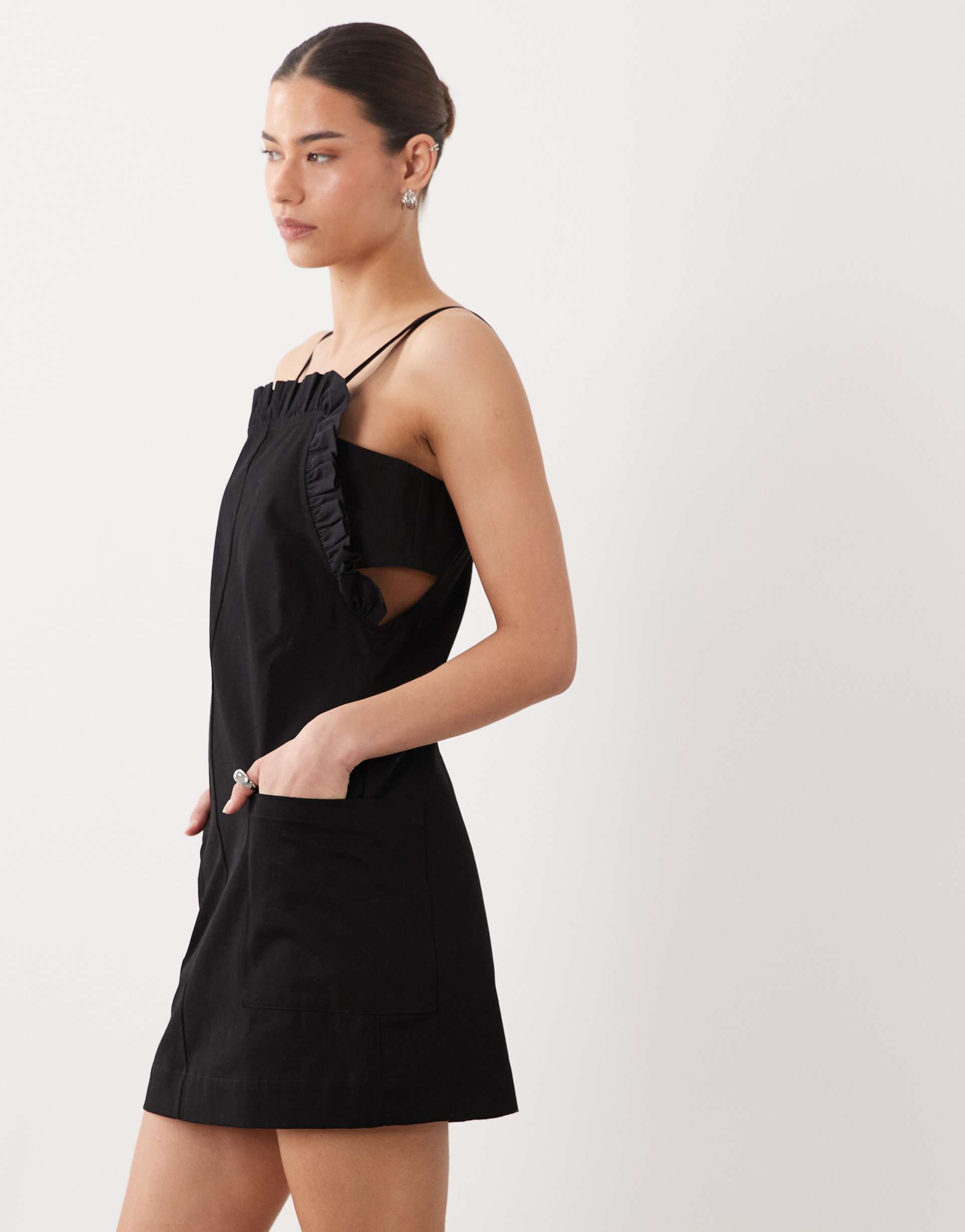 asos design pinny mini dress with pockets and ruffles in black