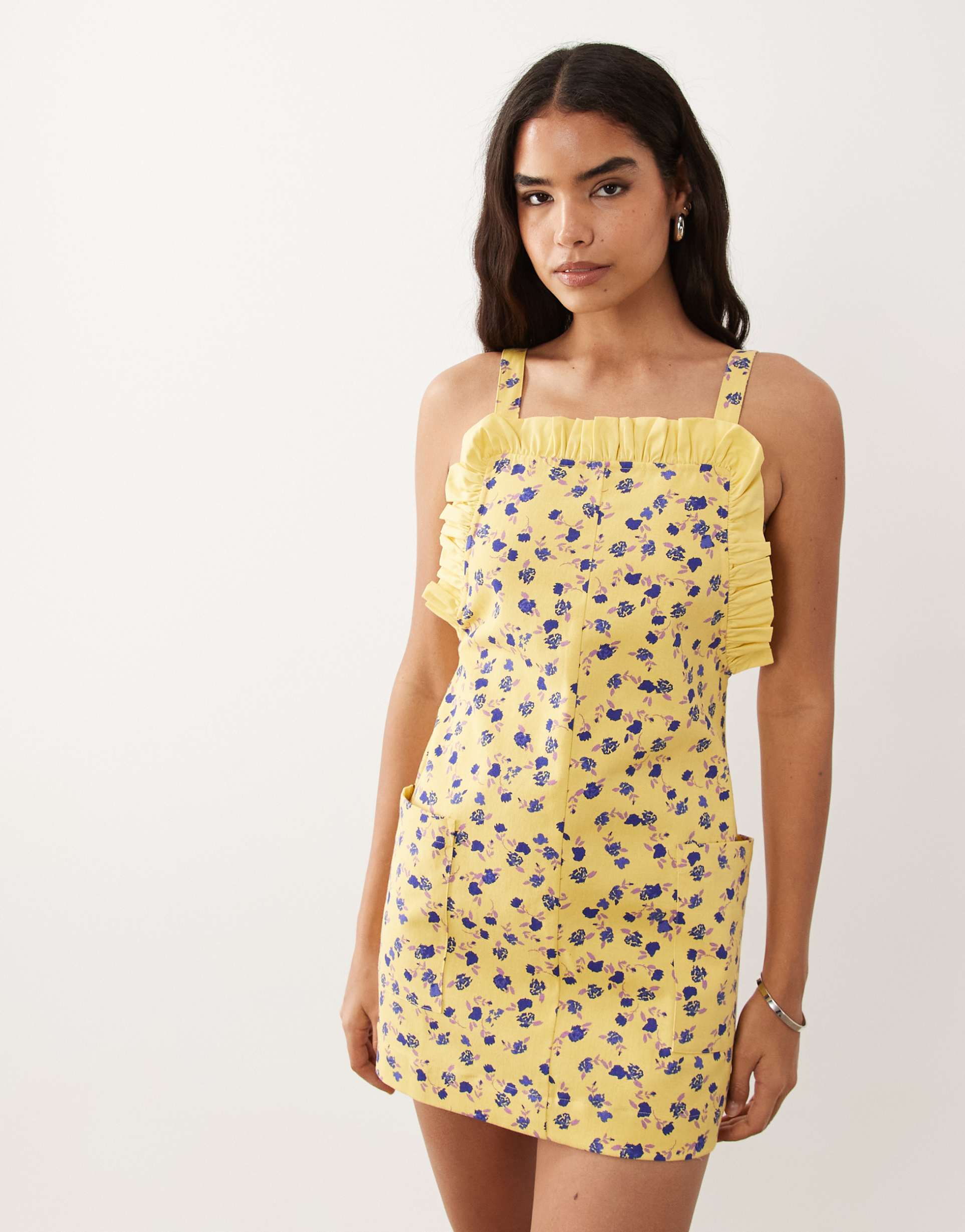 asos design pinny mini dress with pockets and ruffles in yellow ditsy print