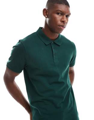 pique polo in dark green