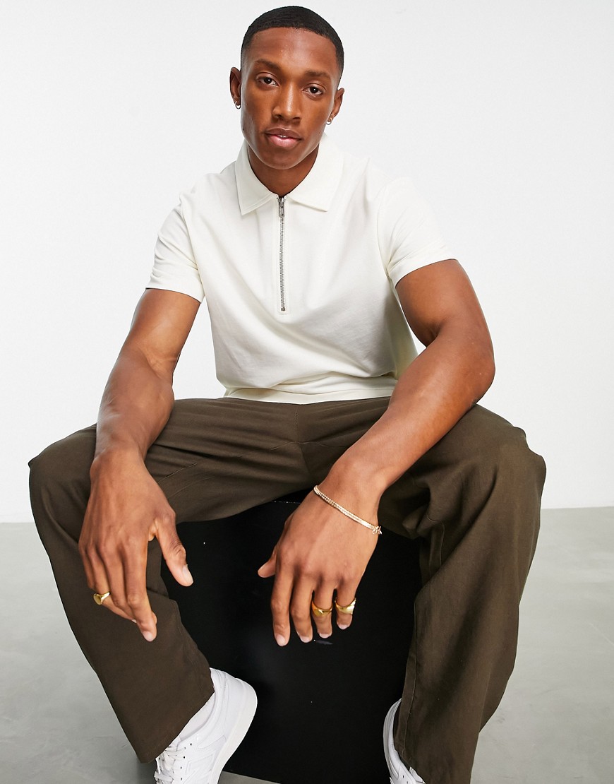 ASOS DESIGN pique polo with zip and rib details in cream-White