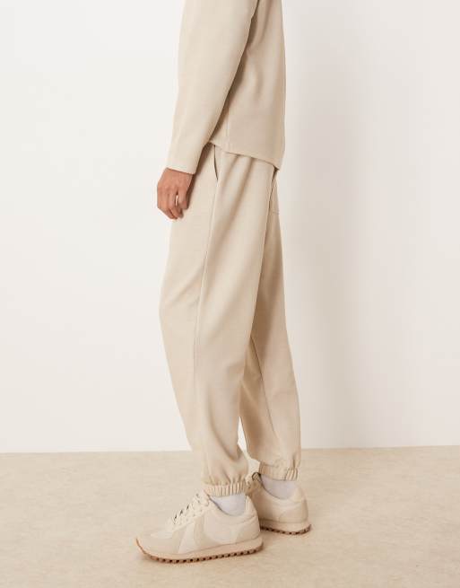 ASOS DESIGN pique tapered trackies set with pin tuck in beige, 3 of 5
