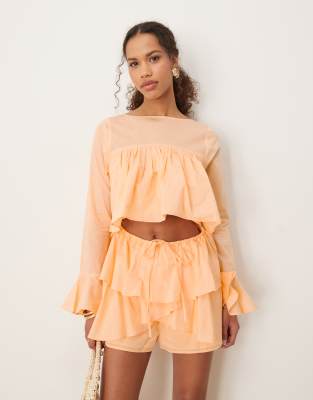 ASOS DESIGN - Playsuit aus Baumwolle in Pfirsich mit Rüschen und Cut-out-Orange