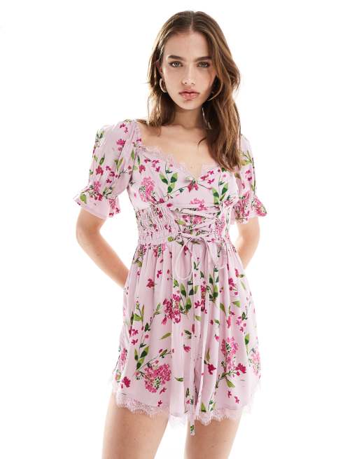 ASOS DESIGN - Playsuit met korsettaille en melkmeisjesmodel in roze met bloemenprint