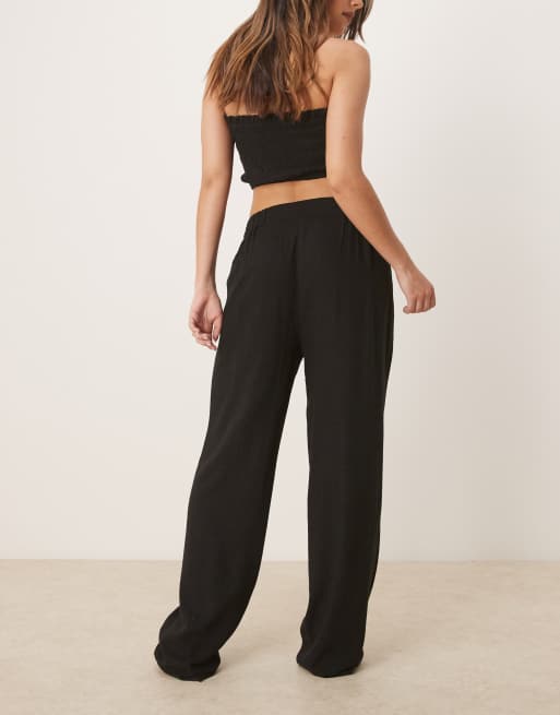 ASOS DESIGN pleat front tapered pants with linen in black