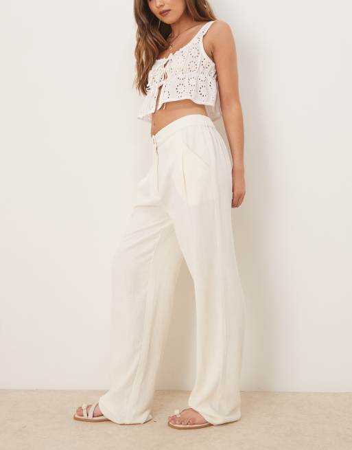 ASOS DESIGN pleat front tapered pants with linen in cream