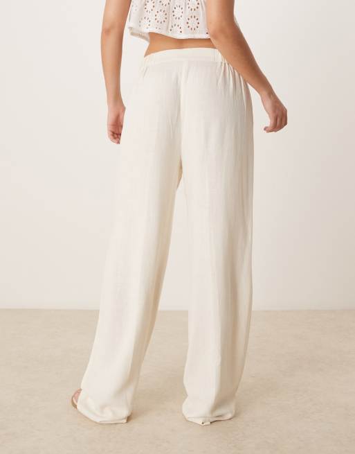 ASOS DESIGN pleat front tapered pants with linen in cream