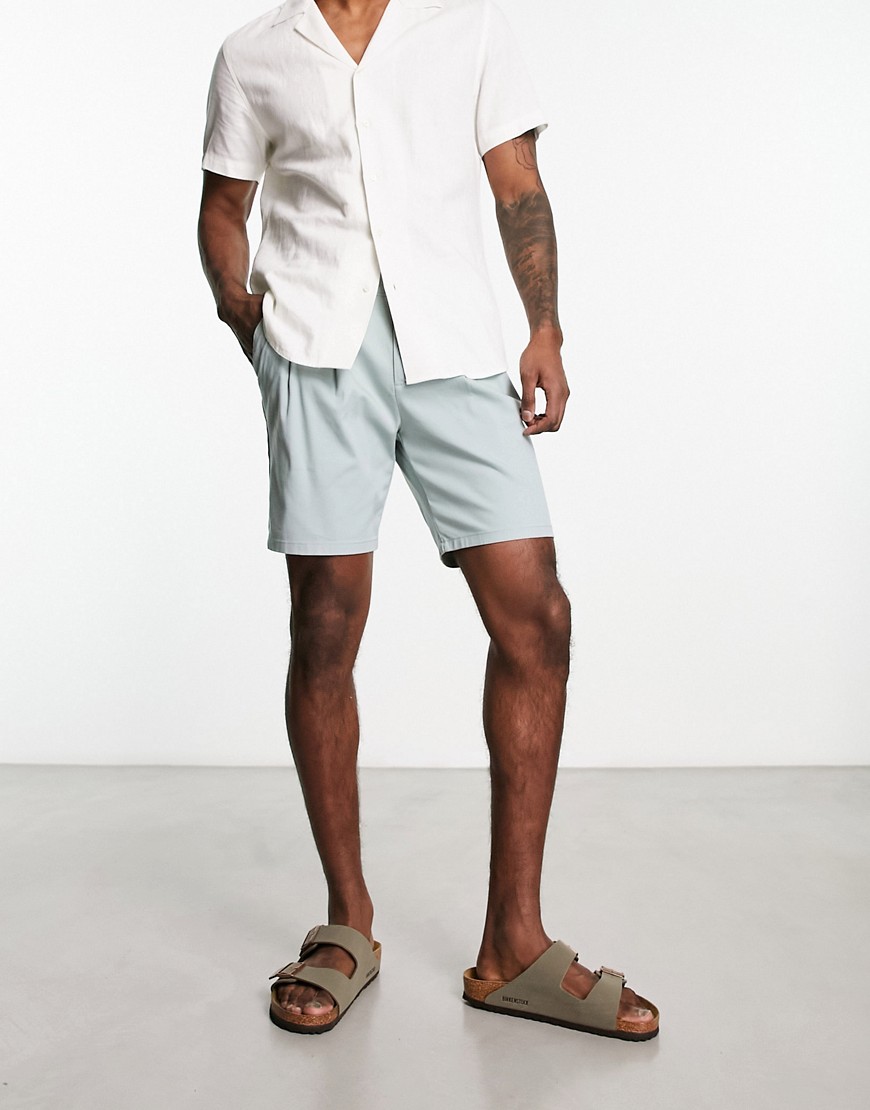 ASOS DESIGN pleated chino shorts in mid length in blue