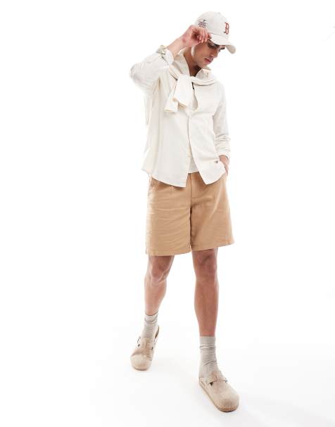 ASOS DESIGN pleated linen shorts in brown - view 1