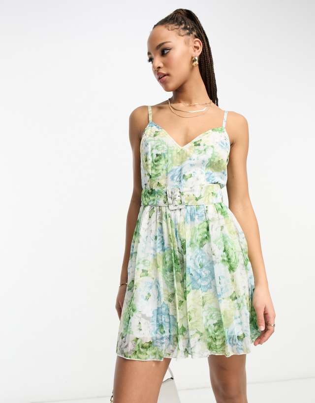 ASOS DESIGN - pleated playsuit with belt in blue floral