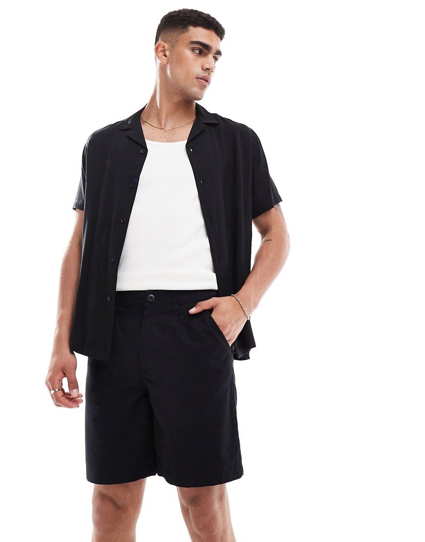 Asos Design Pleated Regular Length Linen Shorts With Fixed Waist In Black