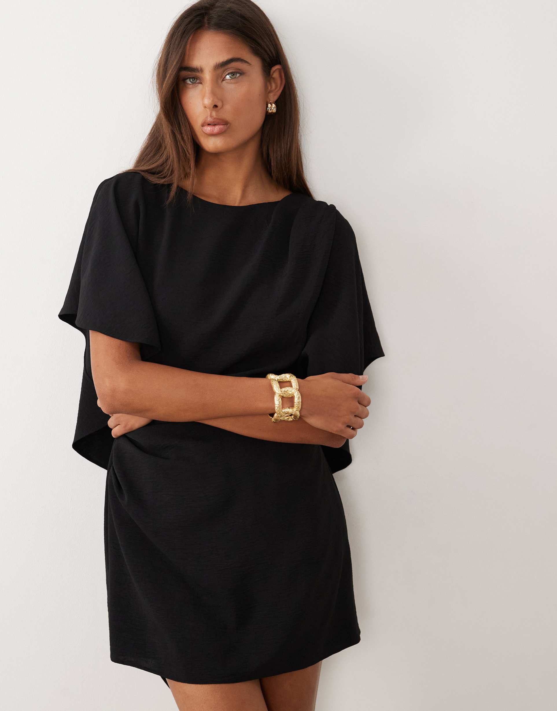 asos design pleated romper with ruffle open back in black