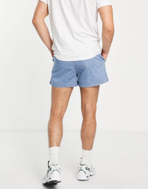 ASOS DESIGN pleated shorter length denim shorts in light wash blue